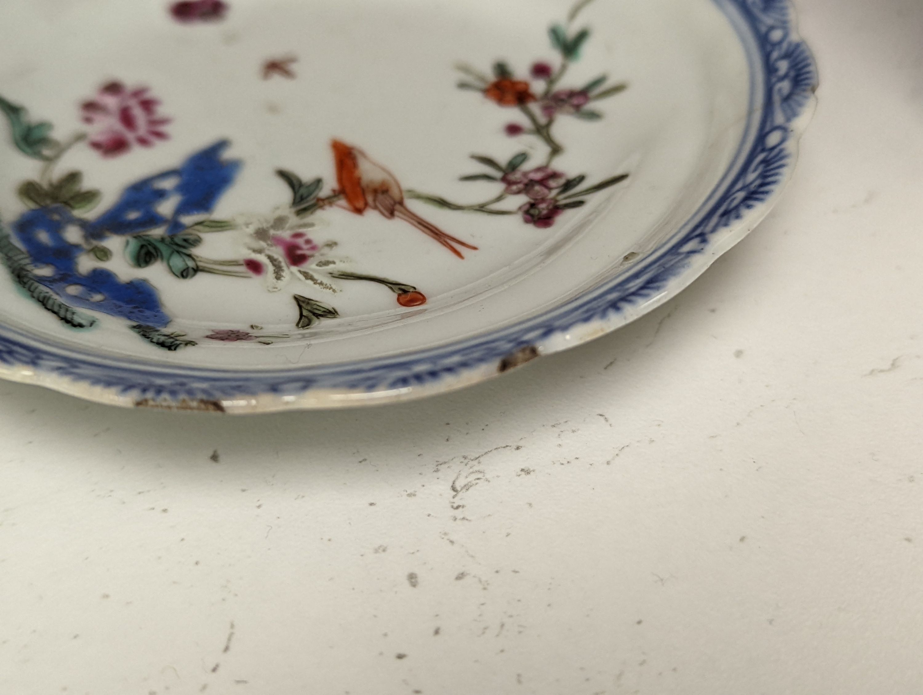 Seven 18th century Chinese saucer dishes, largest 14 cms diameter.